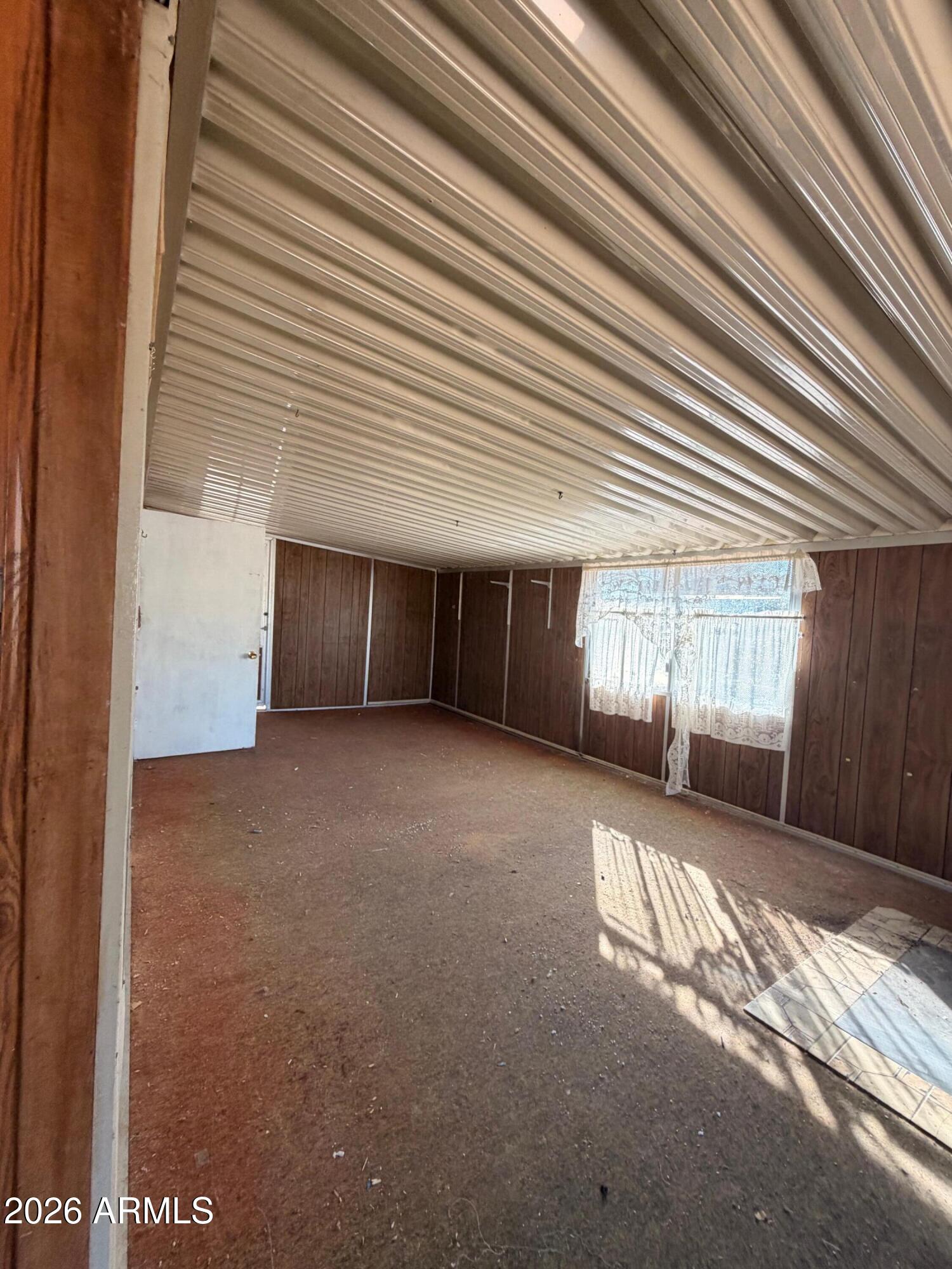 1144 West Edwards Lane Benson, AZ 85602 - Photo 27 of 30 a view of a house with a yard and garage