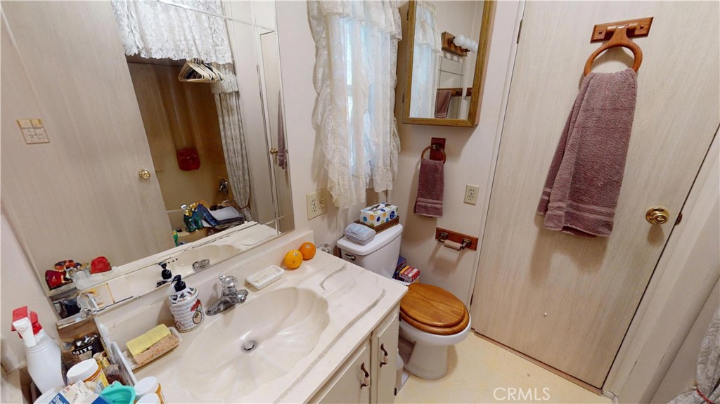14851 Jeffrey Road, Unit 117 Irvine, CA 92618 - Photo 18 of 45 a bathroom with a sink and a mirror