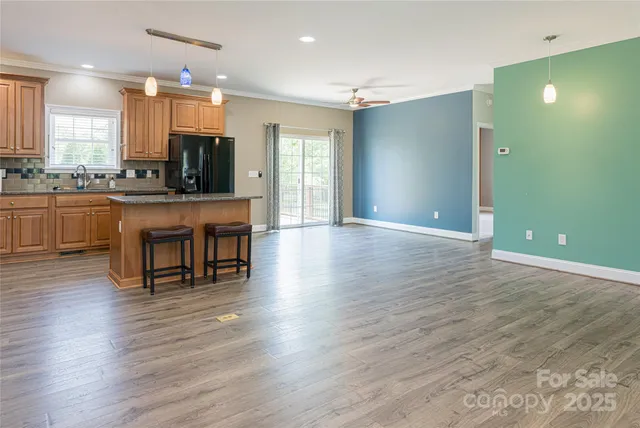a view of kitchen with cabinets and wooden floor