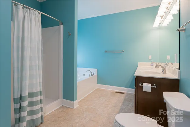 a bathroom with a toilet and a sink