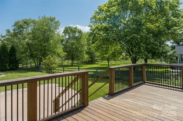 a view of a balcony with wooden floor