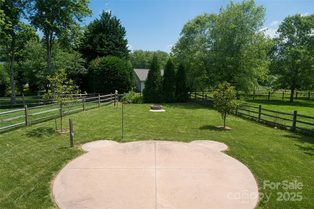 a view of a park with large trees