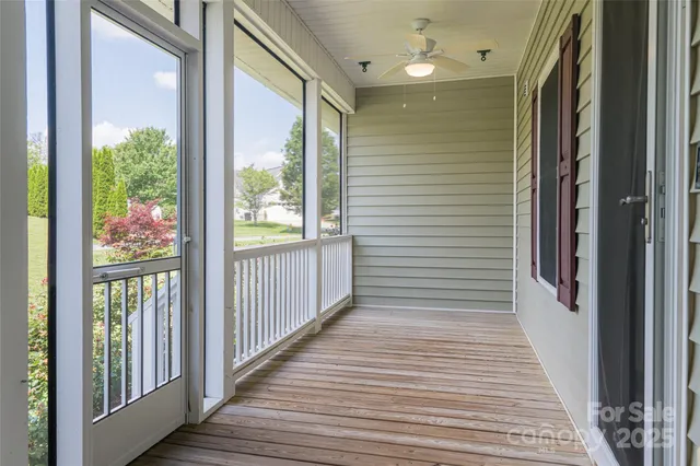 a view of a balcony with wooden floor