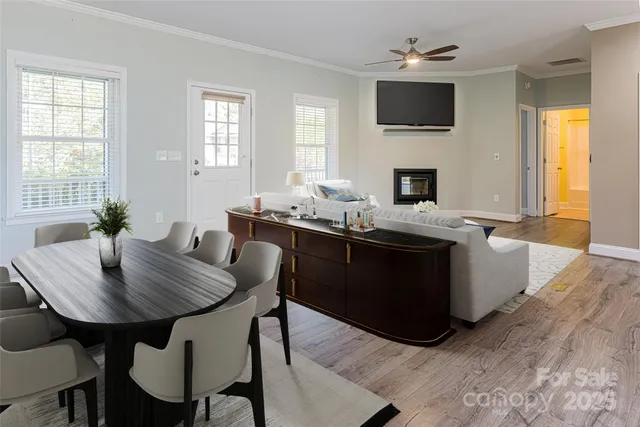 a dining room with furniture and window