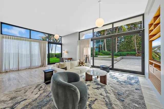 a large kitchen with stainless steel appliances granite countertop a lot of counter space and a sink