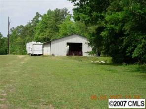 2003 Freds Way Chester, SC 29706 - Photo 2 of 4 a front view of a house with a garden