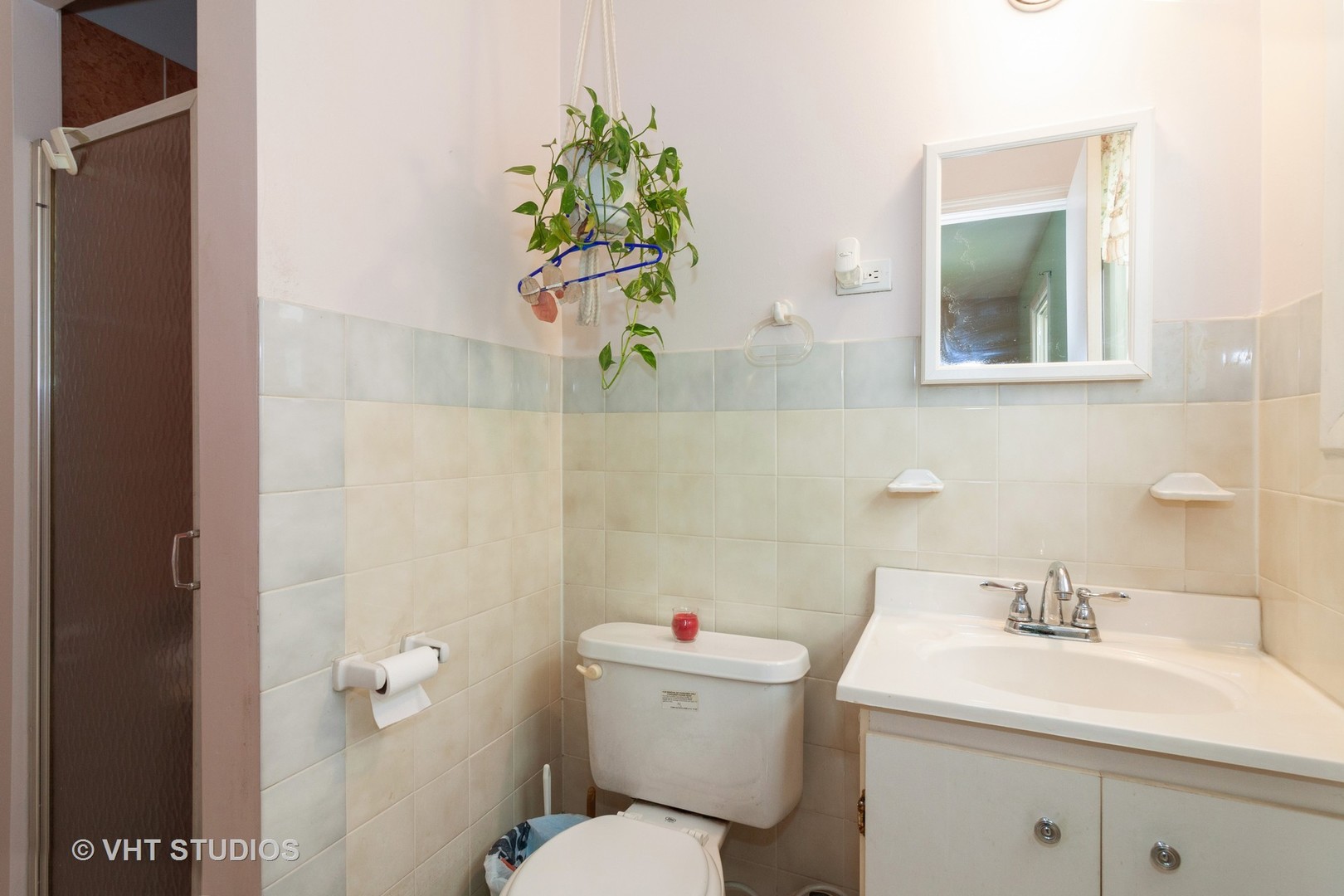 547 White Oak Road Bolingbrook, IL 60440 - Photo 13 of 19 a bathroom with a sink a toilet and a mirror