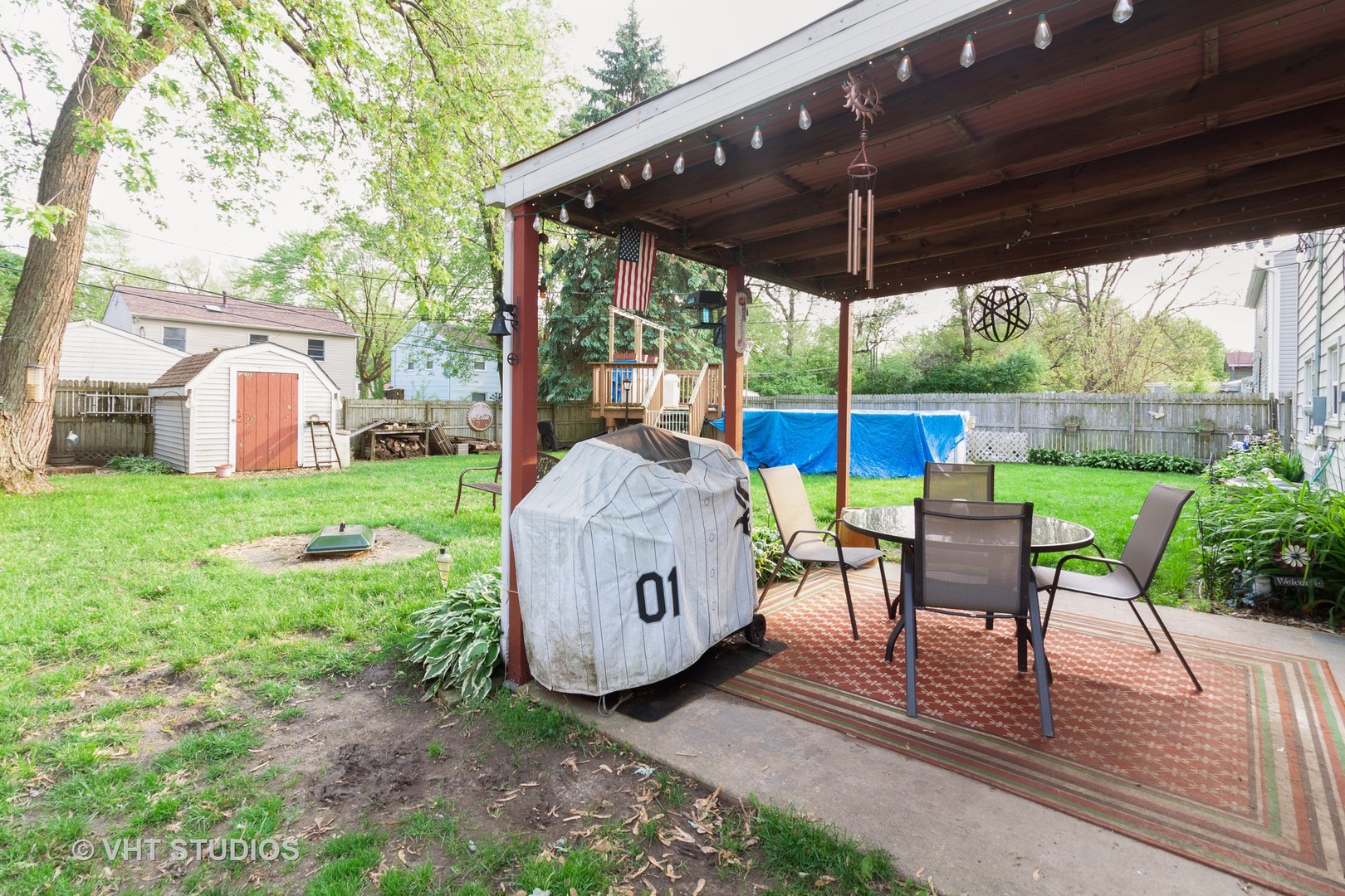 547 White Oak Road Bolingbrook, IL 60440 - Photo 18 of 19 a view of a patio with a table chairs and a backyard