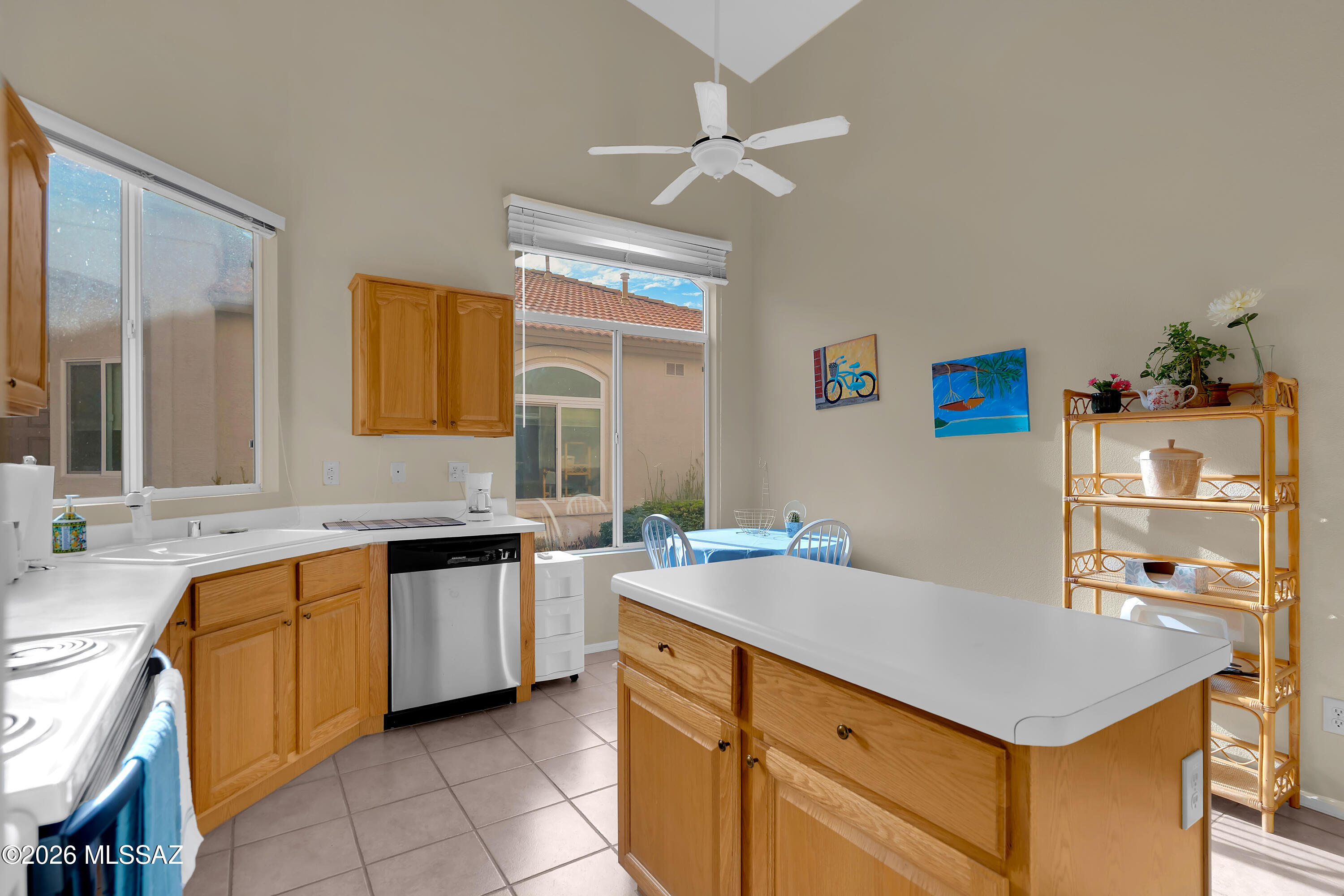 64351 East Wind Ridge Circle Tucson, AZ 85739 - Photo 13 of 41 a kitchen with a sink refrigerator and cabinets
