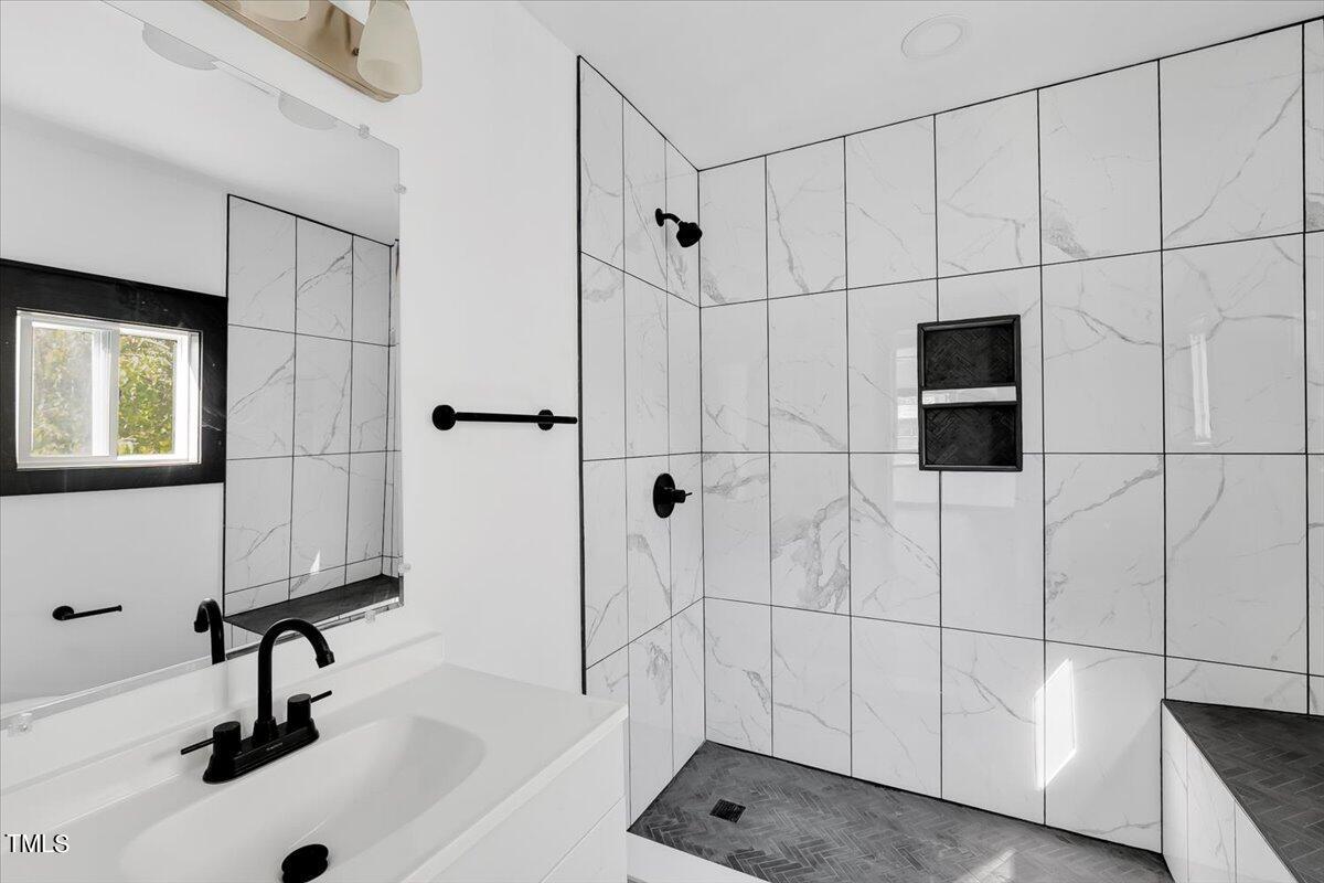 321 East Umstead Street Durham, NC 27707 - Photo 13 of 22 a bathroom with a sink and a shower