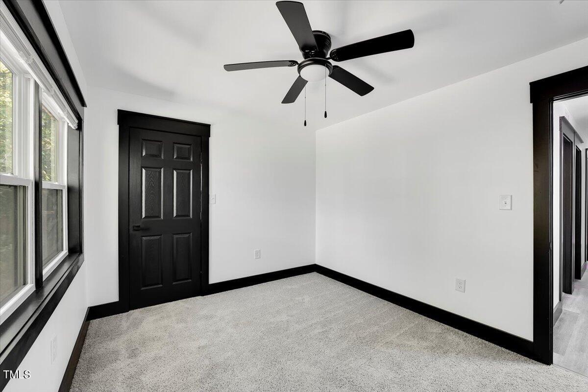 321 East Umstead Street Durham, NC 27707 - Photo 18 of 22 a view of a hallway with a ceiling fan