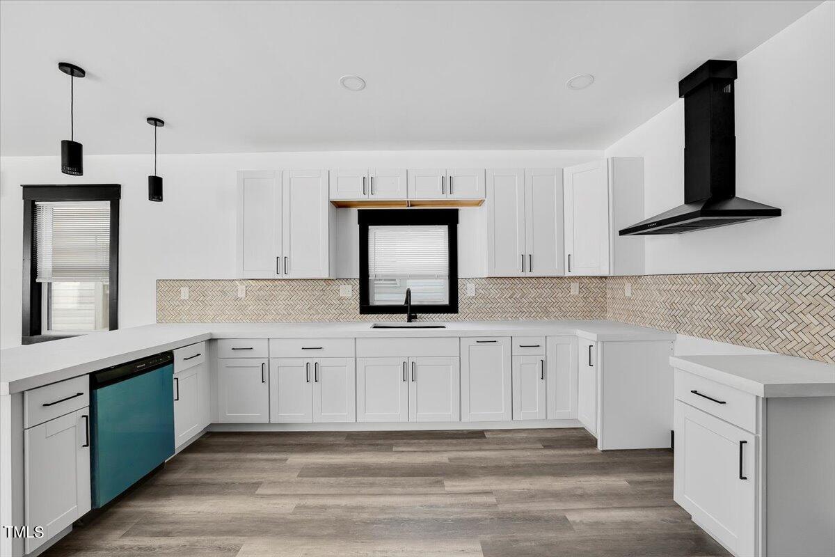 321 East Umstead Street Durham, NC 27707 - Photo 8 of 22 a white kitchen with granite countertop white cabinets and a sink