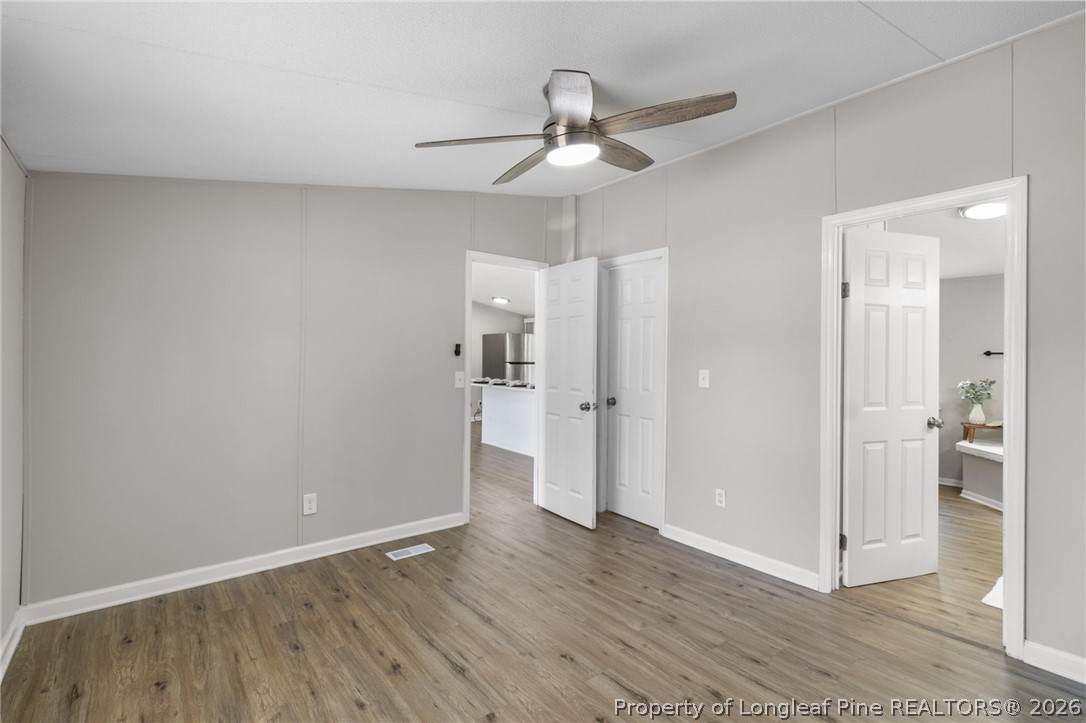 6568 Sandy Creek Road Stedman, NC 28391 - Photo 13 of 34 a view of an empty room and wooden floor