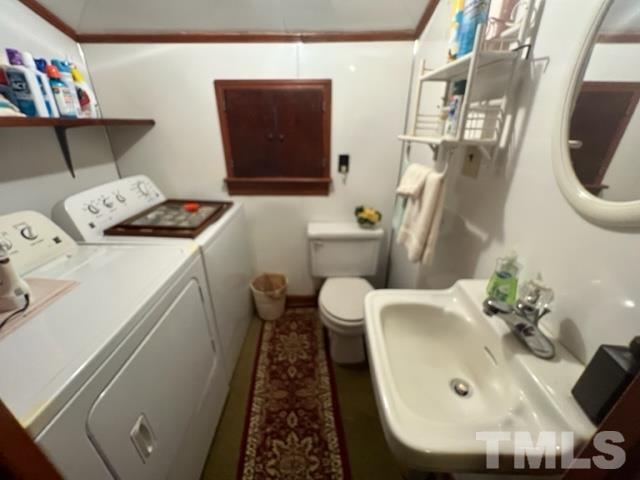 71 Roberts Grove Road Dunn, NC 28334 - Photo 12 of 23 a bathroom with a sink and a mirror