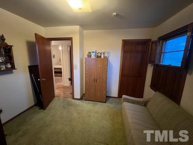 71 Roberts Grove Road Dunn, NC 28334 - Photo 15 of 23 a view of a hallway with closet and mirror