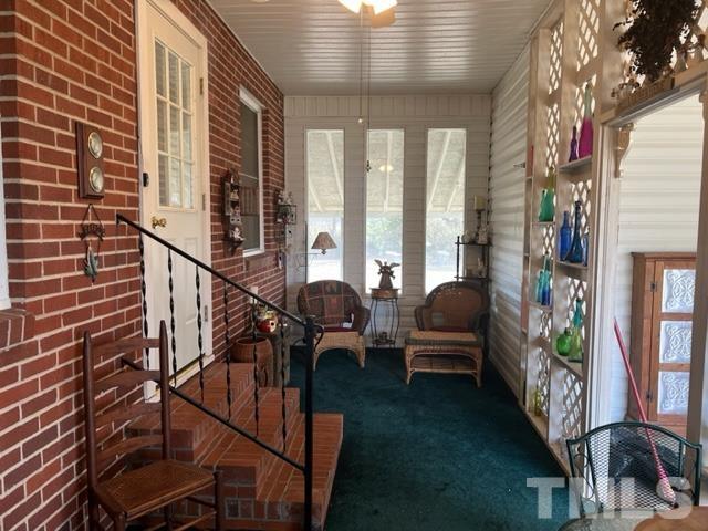 71 Roberts Grove Road Dunn, NC 28334 - Photo 17 of 23 a balcony with furniture and a potted plant