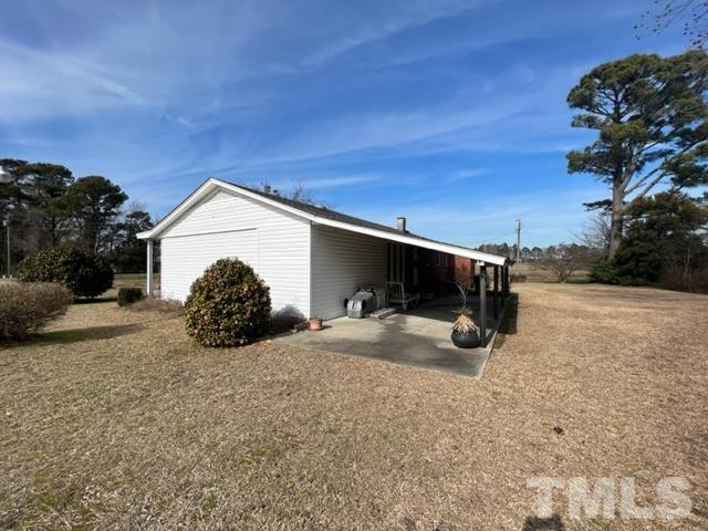 71 Roberts Grove Road Dunn, NC 28334 - Photo 21 of 23 a view of a house with a snow in front of yard