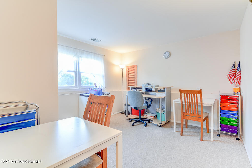 116 Newbury Road Howell, NJ 07731 - Photo 15 of 19 a living room with furniture and a table