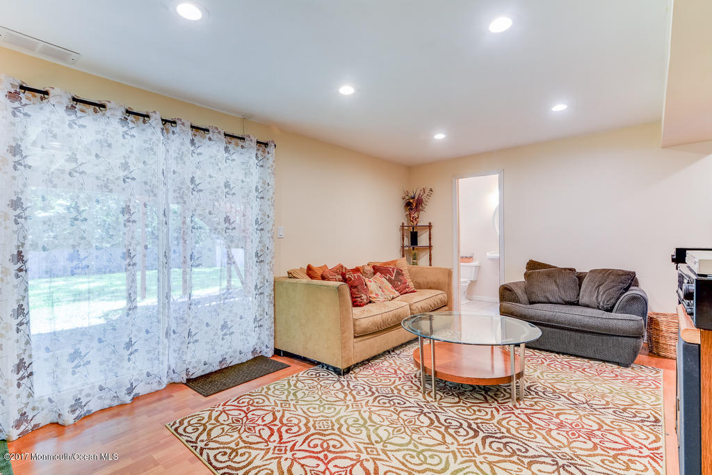 116 Newbury Road Howell, NJ 07731 - Photo 16 of 19 a living room with furniture and a large window