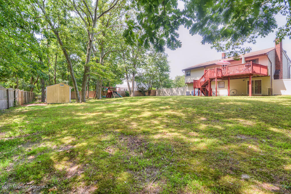 116 Newbury Road Howell, NJ 07731 - Photo 18 of 19 a view of a house with a yard
