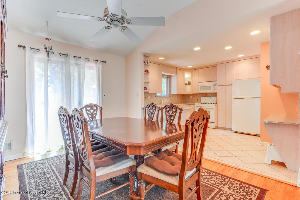 116 Newbury Road Howell, NJ 07731 - Photo 4 of 19 a view of a dining room with furniture and a chandelier