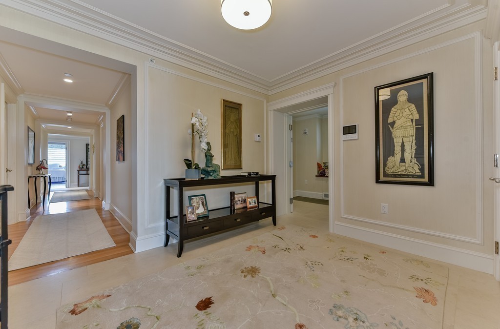 100 Beacon Street, Unit 7 Boston, MA 02116 - Photo 13 of 17 a view of a hallway to a livingroom with furniture