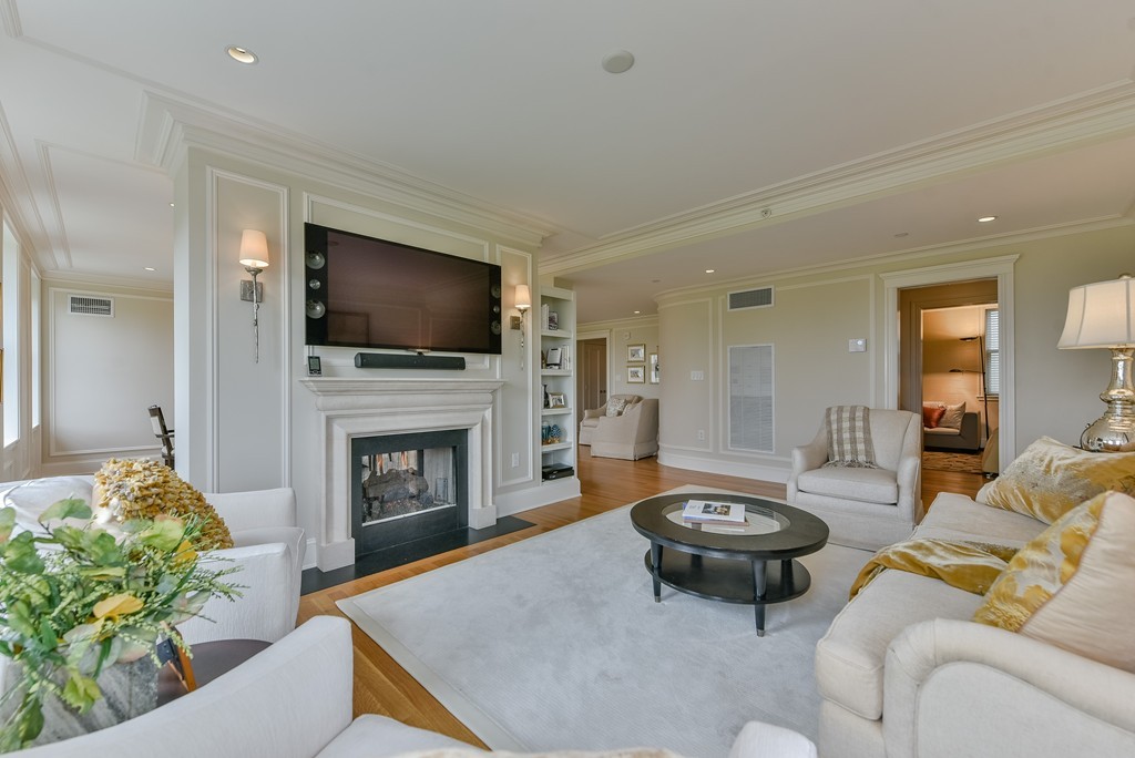 100 Beacon Street, Unit 7 Boston, MA 02116 - Photo 5 of 17 a living room with furniture a fireplace and a flat screen tv