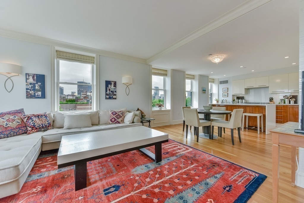 100 Beacon Street, Unit 7 Boston, MA 02116 - Photo 6 of 17 a living room with a couch and a table