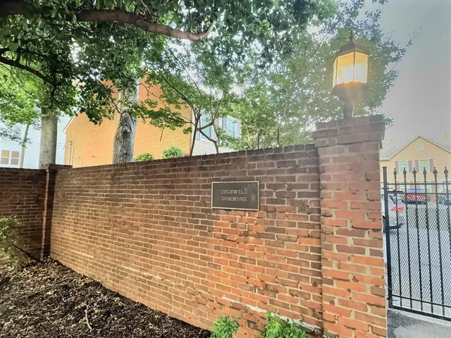 a brick building with a street