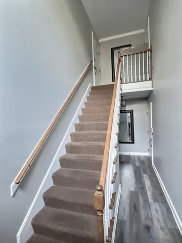a view of entryway with wooden floor