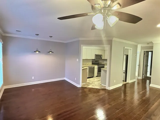 a view of a kitchen with a sink and a kitchen view