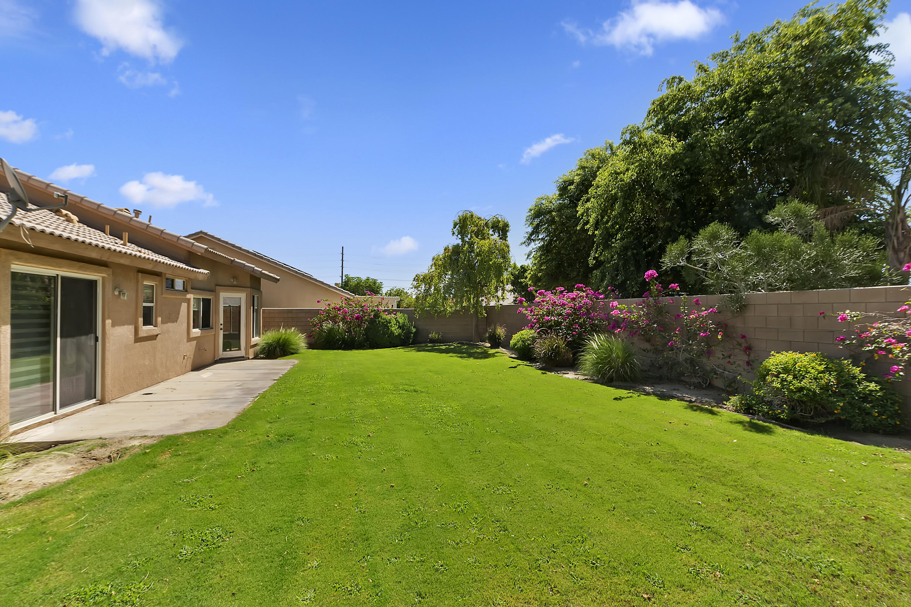 80669 Freedom Avenue Indio, CA 92201 - Photo 20 of 30 a front view of a house with garden