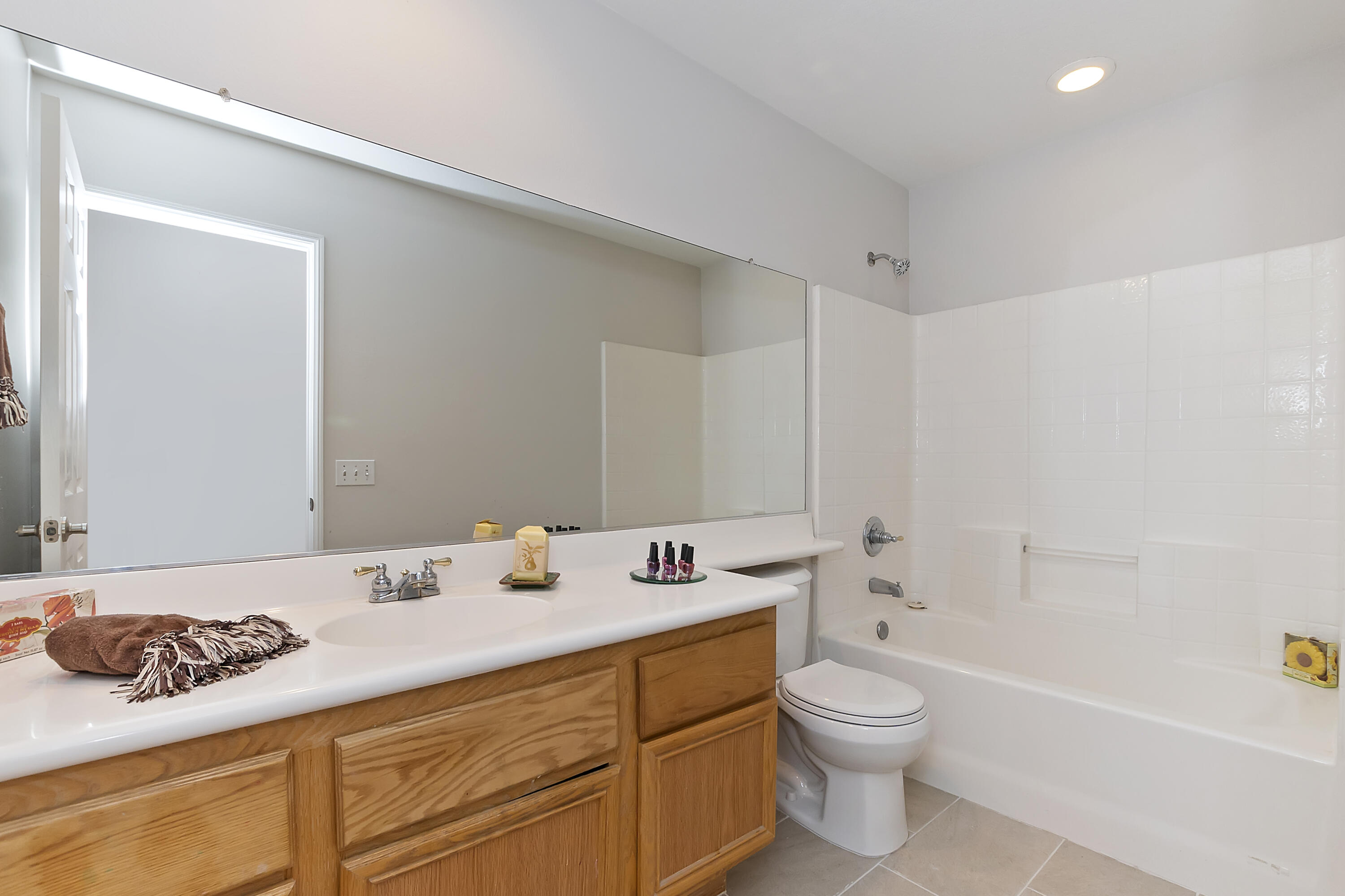 80669 Freedom Avenue Indio, CA 92201 - Photo 26 of 30 a bathroom with a granite countertop sink a toilet and a bathtub