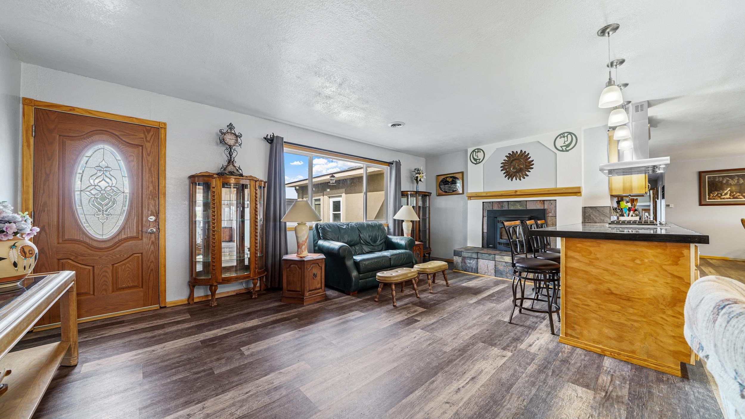 20786 Iris Road Austin, CO 81410 - Photo 8 of 38 a living room with fireplace furniture and a wooden floor