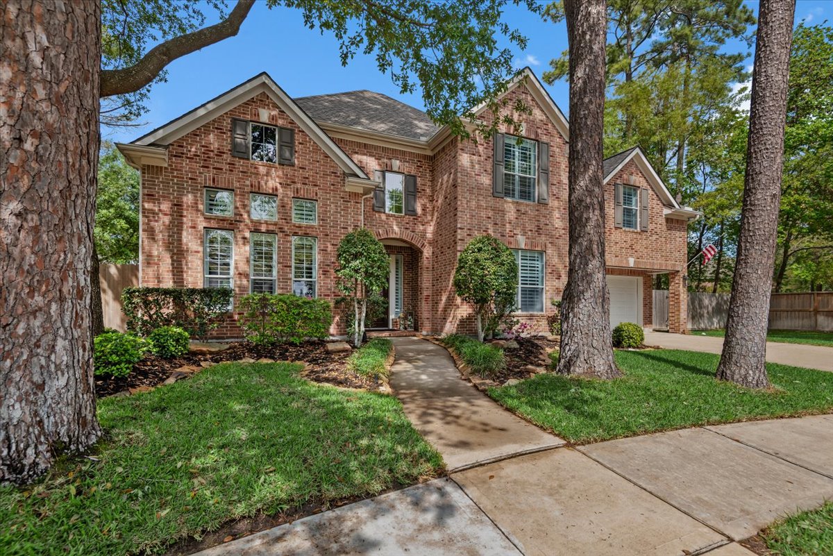 15519 Stallion Point Circle Cypress, TX 77429 - Photo 2 of 37 The property features a brick exterior, a two-car garage, and an inviting front walkway
