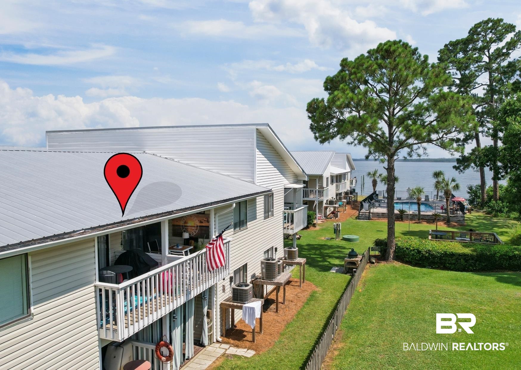 25925 Canal Road, Unit 207 Orange Beach, AL 36561 - Photo 4 of 42 Rear view of property with a lawn
