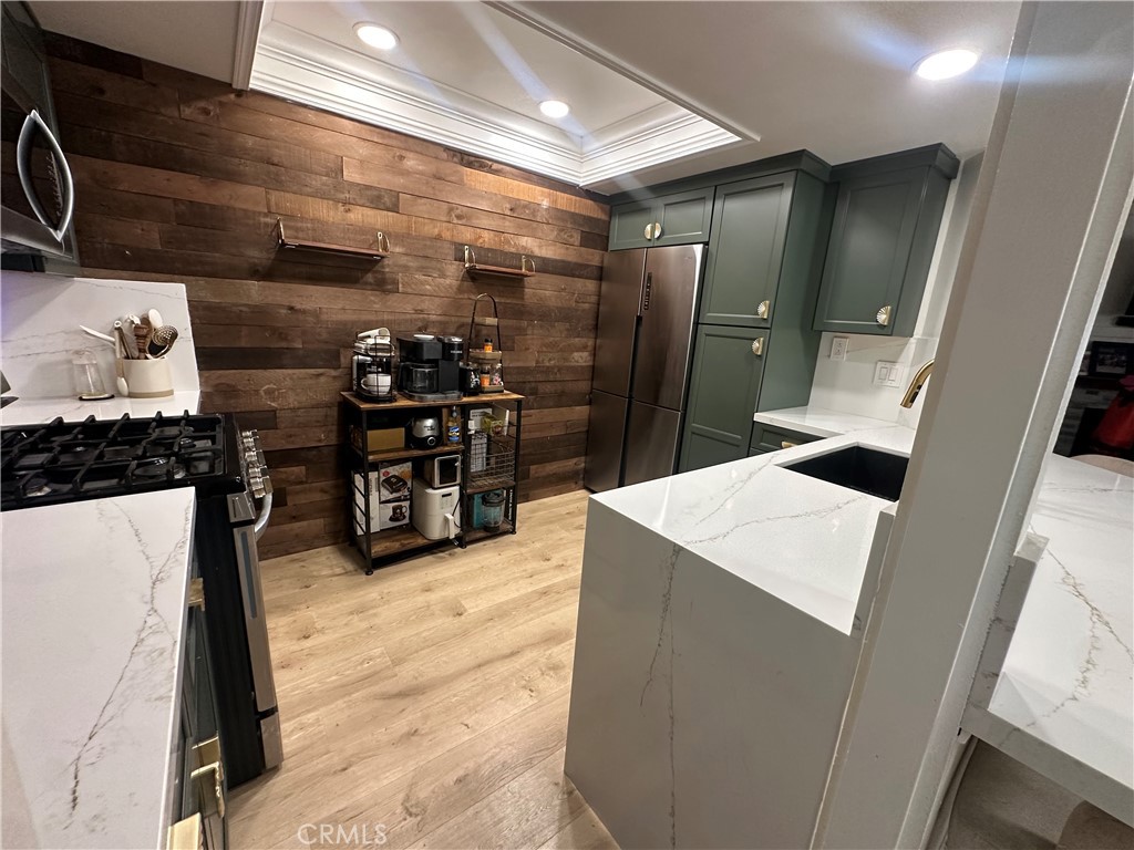 18223 Soledad Canyon Road, Unit 45 Canyon Country, CA 91387 - Photo 15 of 24 a kitchen with stainless steel appliances a refrigerator and a stove