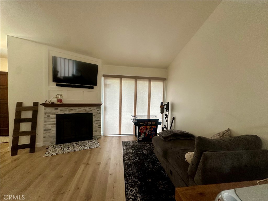 18223 Soledad Canyon Road, Unit 45 Canyon Country, CA 91387 - Photo 23 of 24 a living room with furniture a fireplace and a flat screen tv