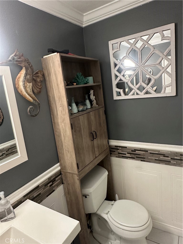 18223 Soledad Canyon Road, Unit 45 Canyon Country, CA 91387 - Photo 3 of 24 a white toilet sitting next to a bathroom sink