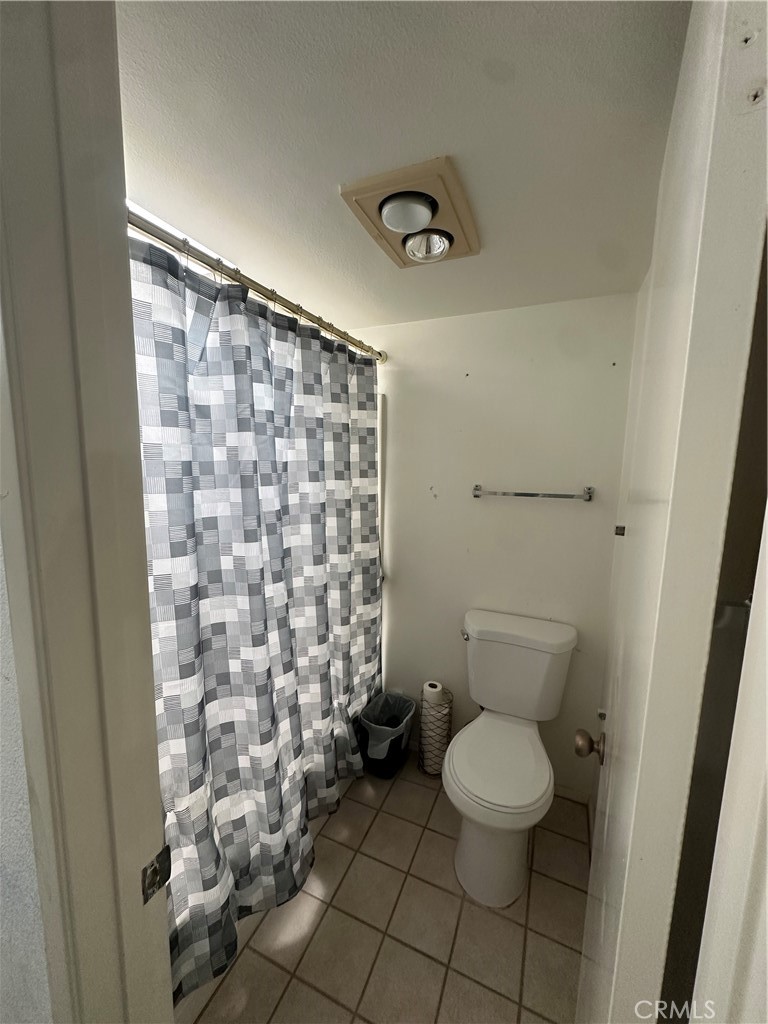 18223 Soledad Canyon Road, Unit 45 Canyon Country, CA 91387 - Photo 5 of 24 a bathroom with a toilet and a shower