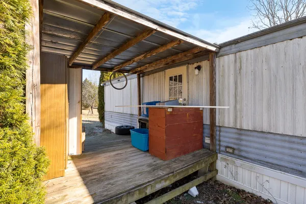 a backyard of a house with barbeque oven