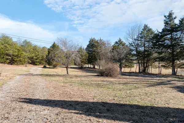 an aerial view of residential house with outdoor space