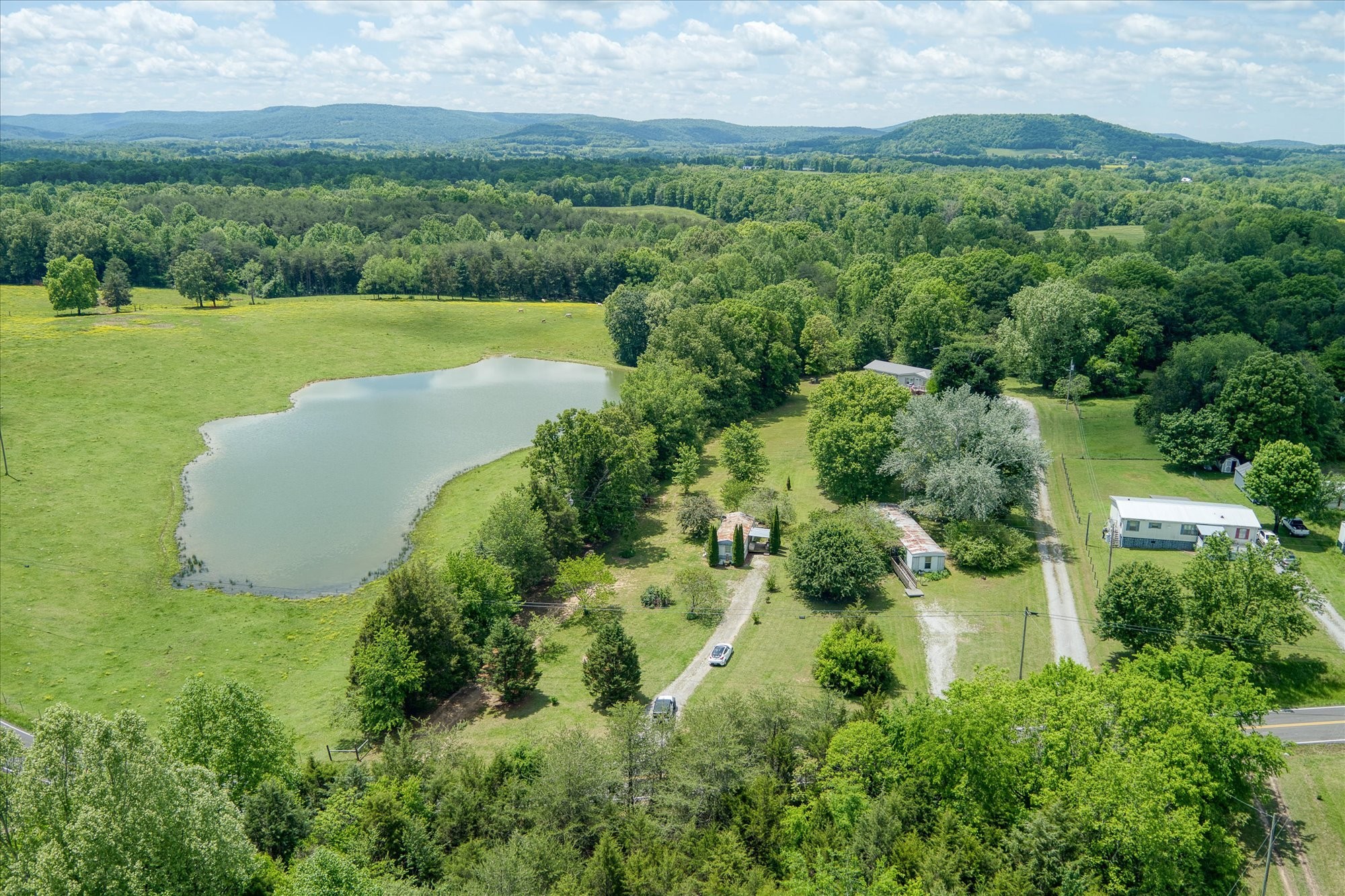 280 Bone Cave Road Rock Island, TN 38581 - Photo 18 of 27 an aerial view of a house with a yard and lake view