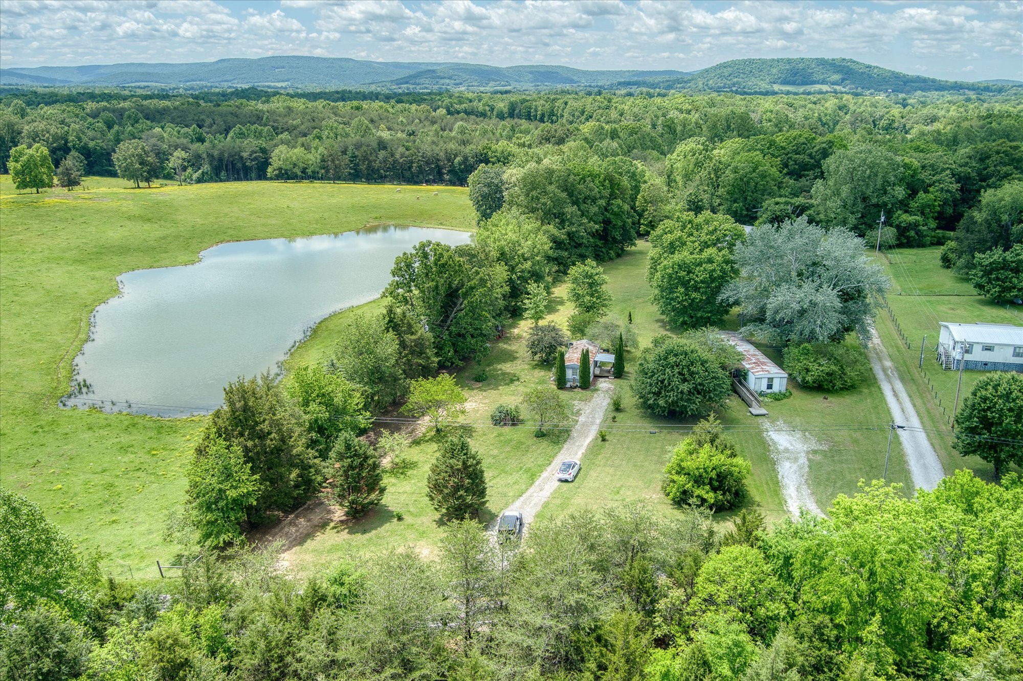 280 Bone Cave Road Rock Island, TN 38581 - Photo 19 of 27 a view of a garden with a lake
