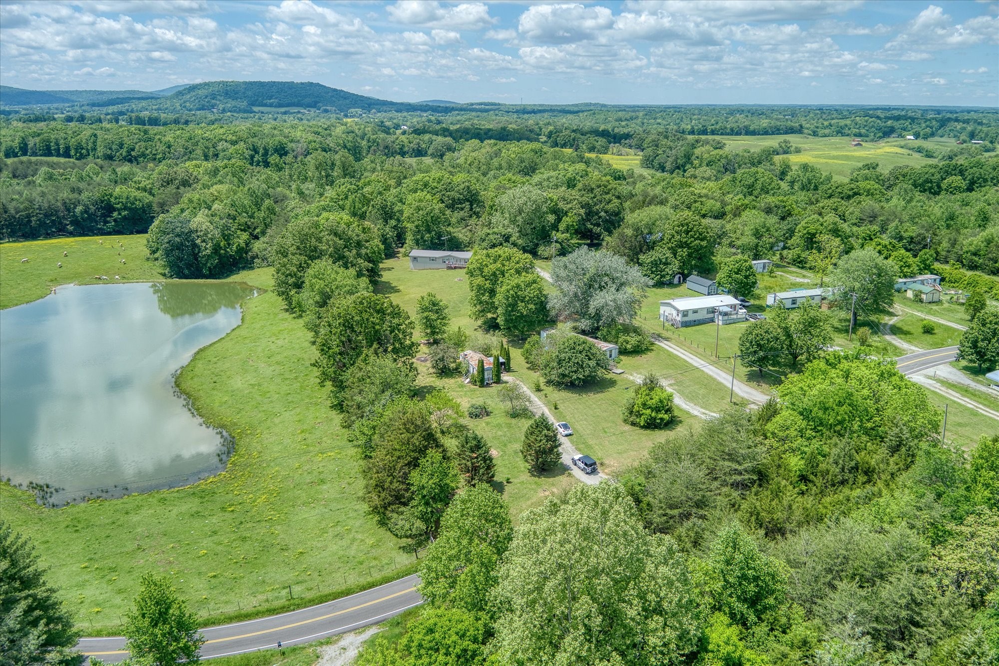 280 Bone Cave Road Rock Island, TN 38581 - Photo 22 of 27 an aerial view of a house with a yard