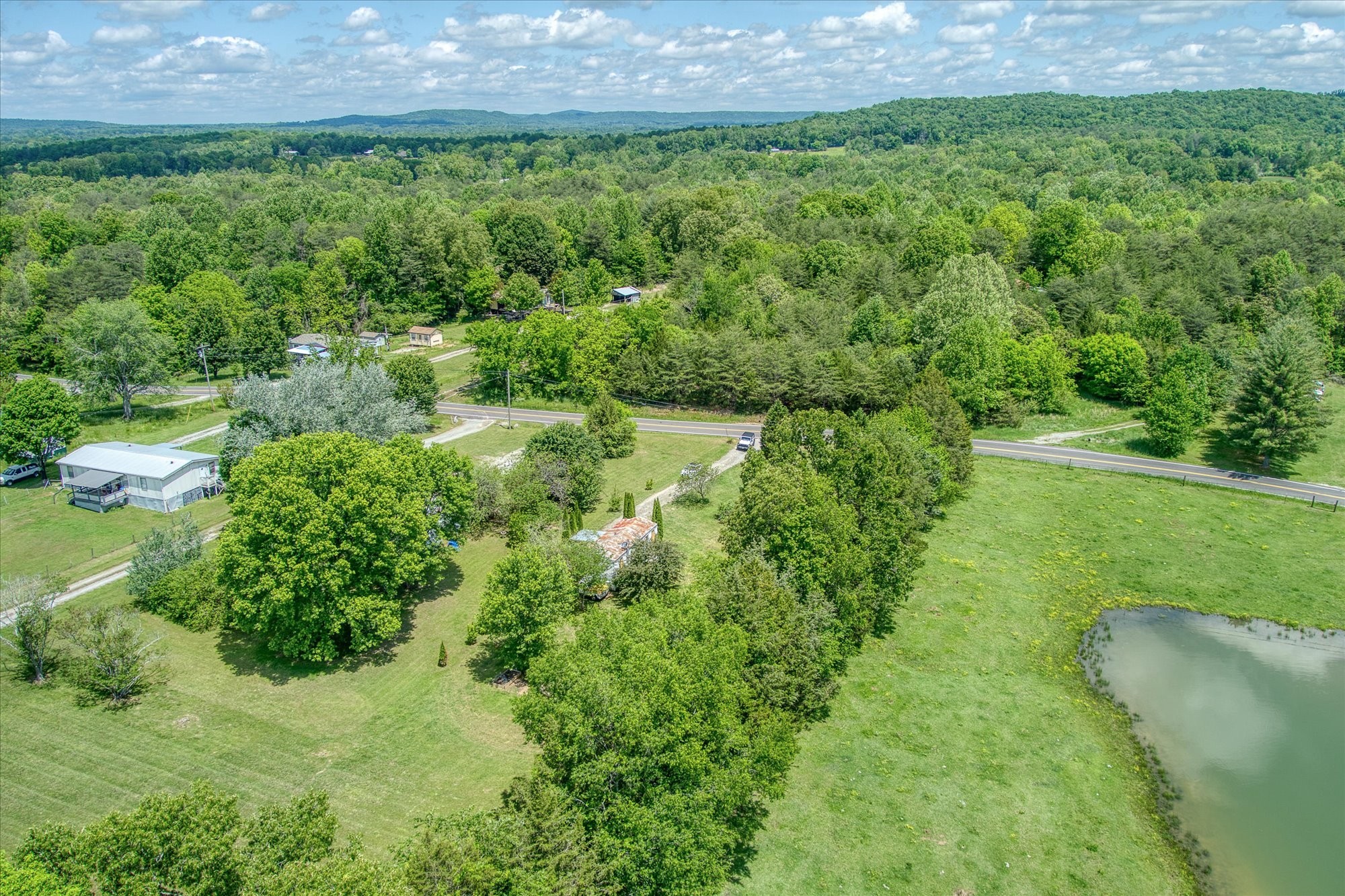 280 Bone Cave Road Rock Island, TN 38581 - Photo 24 of 27 a view of a garden with a building
