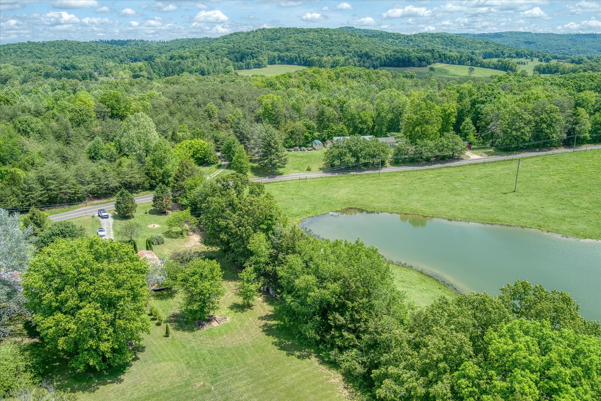 280 Bone Cave Road Rock Island, TN 38581 - Photo 25 of 27 a view of a garden with a lake