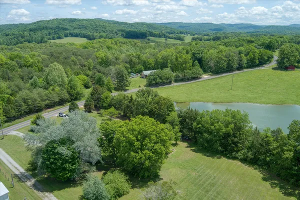 a view of a lake with a yard