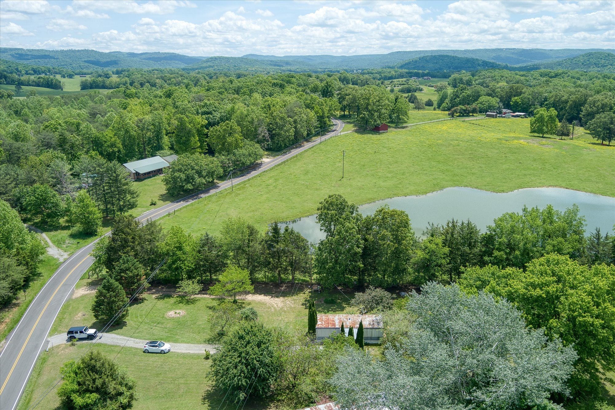 280 Bone Cave Road Rock Island, TN 38581 - Photo 27 of 27 a view of a lake with a yard