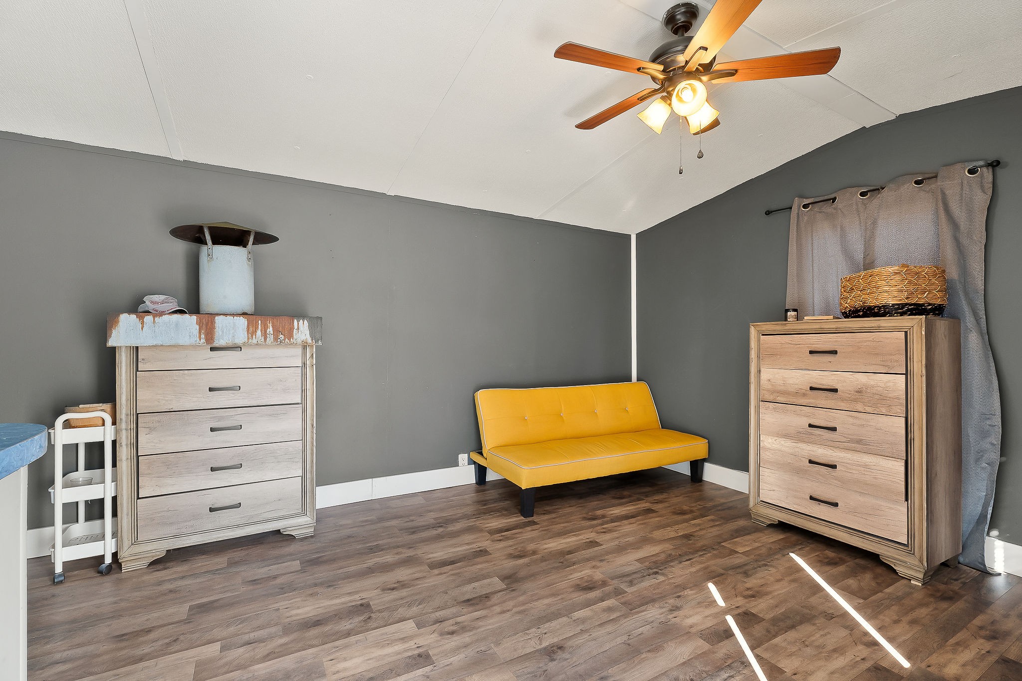 280 Bone Cave Road Rock Island, TN 38581 - Photo 3 of 27 a bedroom with a dresser and a ceiling fan